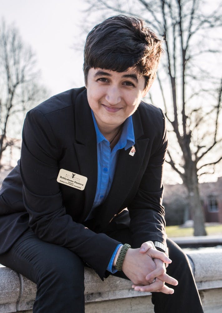 Robiyabonu Dustova poses for a photo next to Frog Baby. Dustova represents the international student demographic in the Student Government Association. DN PHOTO JONATHAN MIKSANEK