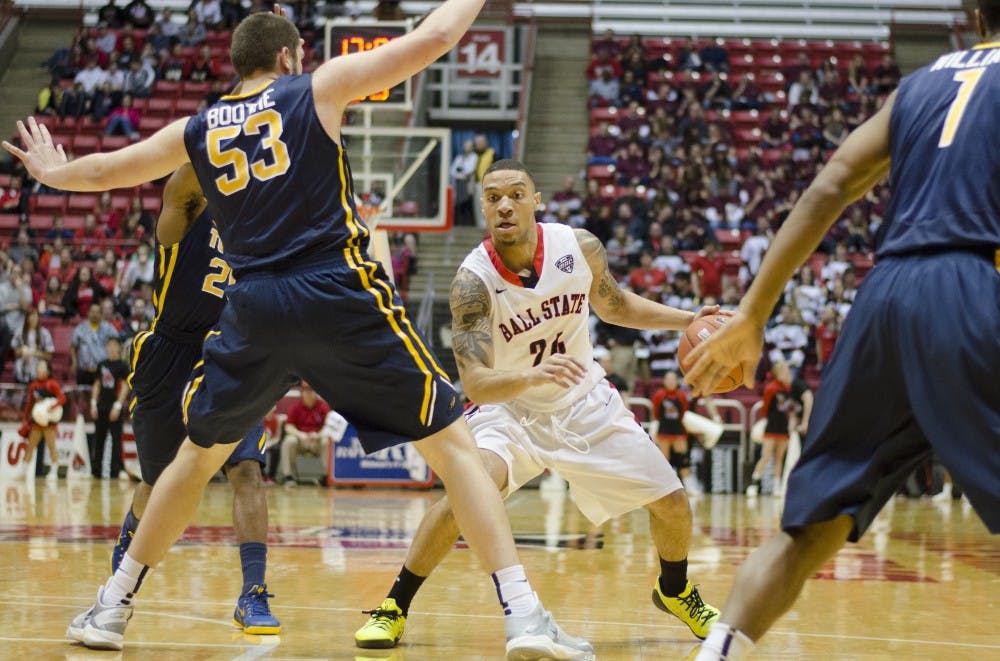 Redshirt junior guard Jeremiah Davis attempts to get passed Toledo player during the game on Feb. 7 at Worthen Arena. DN PHOTO BREANNA DAUGHERTY