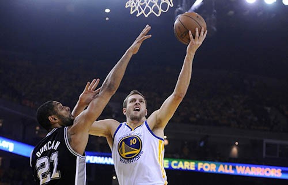 The Golden State Warriors' David Lee takes a shot against the San Antonio Spurs' Tim Duncan in the first quarter of Game 6 in the Western Conference semifinals at Oracle Arena in Oakland, Calif. on Friday. MCT PHOTO