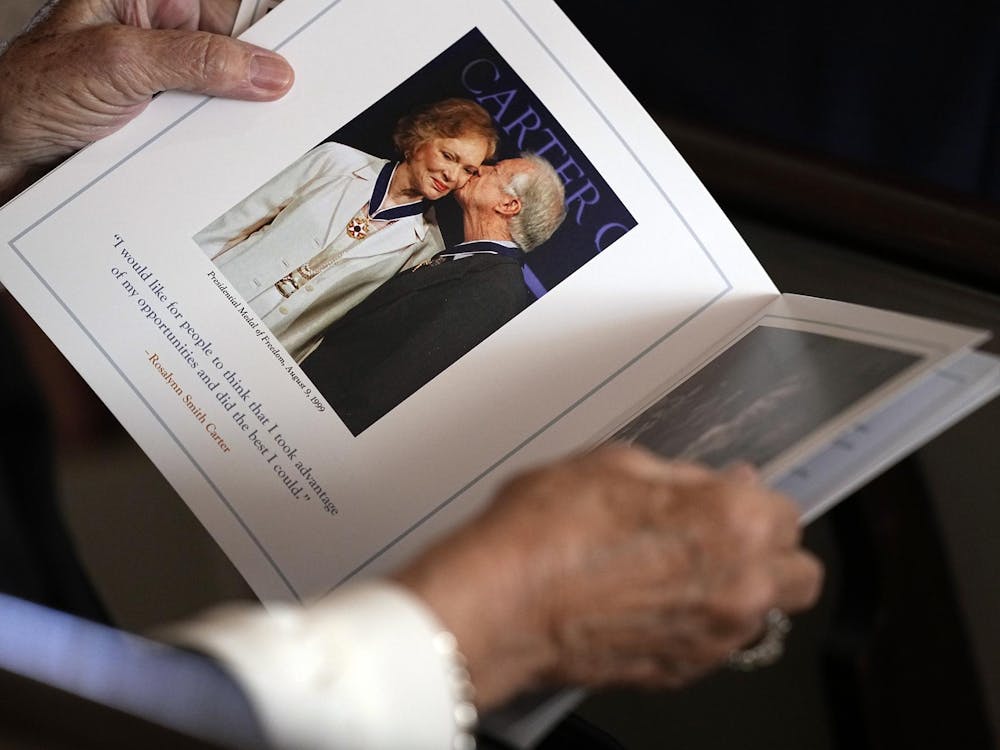 ATLANTA, GEORGIA - NOVEMBER 28: A guest looks at the program before a tribute service for former first lady Rosalynn Carter at Glenn Memorial Church at Emory University on November 28, 2023 in Atlanta, Georgia. Rosalynn Carter, who passed away on November 19 at the age of 96, was married to former U.S. President Jimmy Carter for 77 years. In her lifetime she was an activist and writer known to be an advocate for the elderly, affordable housing, mental health, and the protection of monarch butterflies. (Photo by Brynn Anderson-Pool/Getty Images)