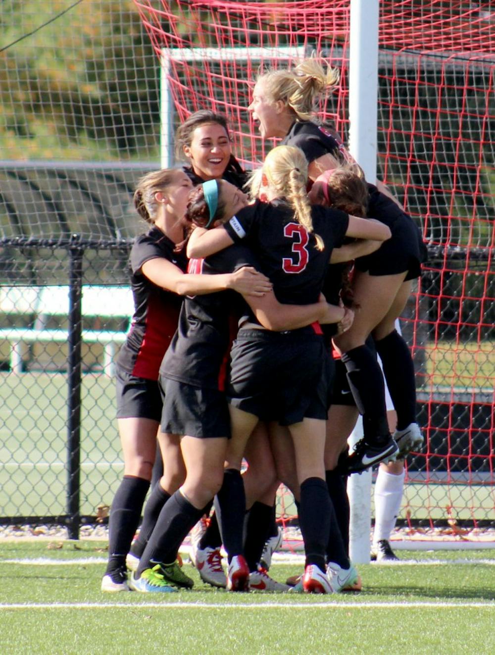 The Ball State Women's Soccer Team gathers for a group hug after winning in overtime in the match against Buffalo on Oct. 25 at the Briner Sports Complex. DN PHOTO ALLYE CLAYTON