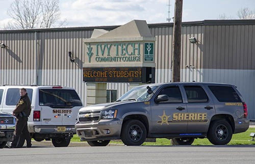 Police blockade the Ivy Tech campus on Cowan Rd. after a bomb threat was called in. Both Ivy Tech locations in Muncie were given the all clear, but both locations will remain closed for the day. DN PHOTO COREY OHLENKAMP 