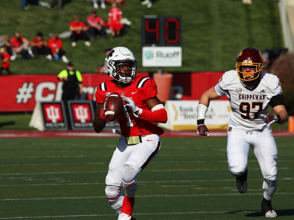 Redshirt sophomore quarterback Kiael Kelly looks to throw the ball against Central Michigan Oct. 21 at Scheumann Stadium. Kelly scored two touchdowns in the game. Mya Cataline, DN
