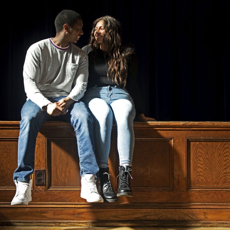 Jericho Barr-Redmond, left, and Noelle Byrer, right, sit on the 