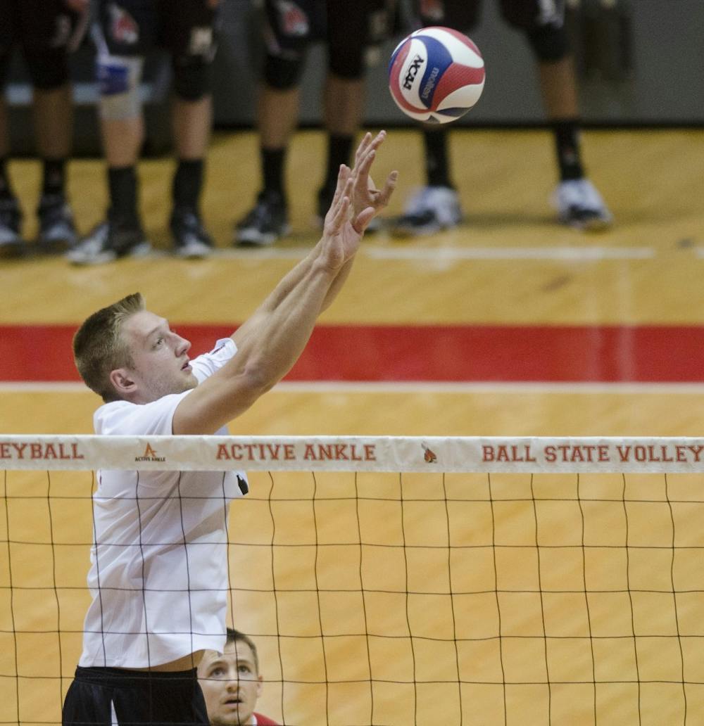 Senior setter Graham McIlvaine sets the ball for a teammate in the match against McKendree Jan. 24 at Worthen Arena. McIlvaine had two digs. DN PHOTO BREANNA DAUGHERTY
