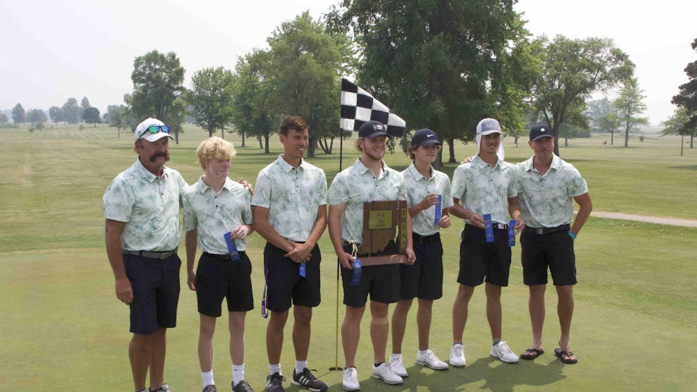 Yorktown golf team poses on the ninth green with their sectional trophy. The Tigers will play for a regional championship on June 8. Elijah Poe, DN