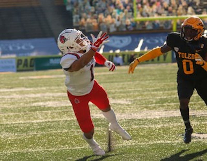Ball State graduate student wide receiver Antwan Davis reaches for the ball against Toledo senior cornerback Samuel Womack Nov. 28, 2020 at the Glass Bowl in Toledo, Ohio. Davis finished Saturday&#x27;s 27-24 win with 41 receiving yards against the Rockets. Maeve Bradfield, Ball State Athletics. 