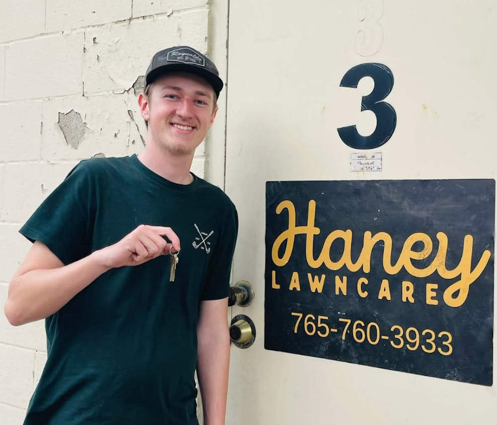 Courtesy of Jason Haney. Drew Haney receiving keys to his new warehouse. 