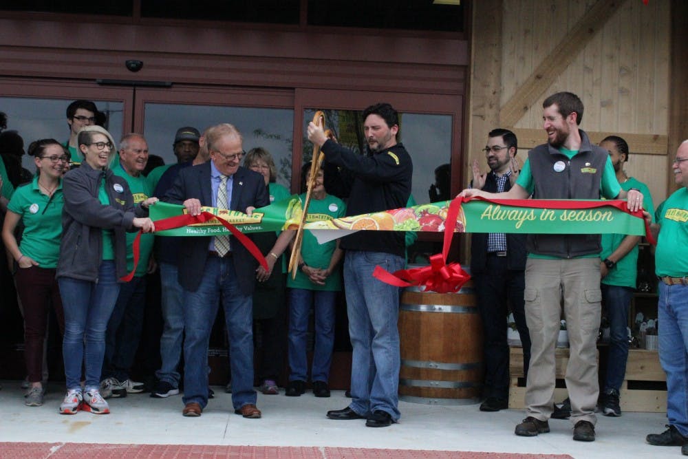 <p>Mayor Tyler Dennis and Fresh Thyme employees cut the ribbon for their grand opening, Wednesday May 16 at the organic grocery store, Fresh Thyme. The store is located on West McGalliard road, next door to Chick-fil-A. <strong>Andrew Smith, DN</strong></p>