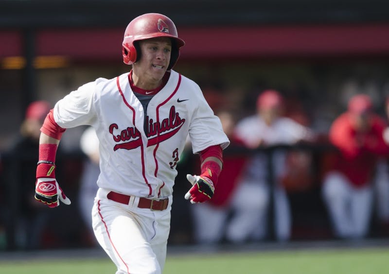 Sophomore outfielder Roman Baisa runs to first base during the game against Ohio University on April 2 at the First Merchants Ballpark Complex. Ball State lost 10-0, bringing the Cardinals losing streak to eight games in a row. Emma Rogers // DN