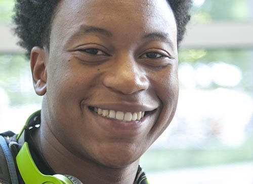 Freshman Markus Burden won free tuition for a semester by making a half-court shot at Welcome Week’s introduction to university athletics. Burden, who is from Illinois, is the first student to win free tuition from the shot. DN PHOTO JORDAN HUFFER