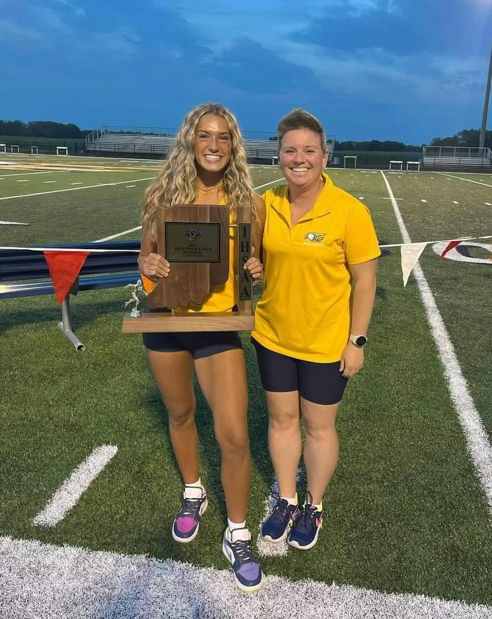 Delta senior Kendra Keesling stands with Delta Track and Field head coach Mackenzie Dye Conley after winning sectionals May 16 at Delta High School. Photo Provided by Mackenzie Dye Conley.
