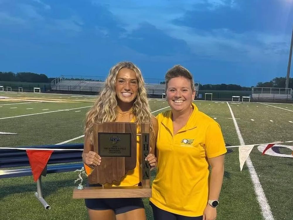 Delta senior Kendra Keesling stands with Delta Track and Field head coach Mackenzie Dye Conley after winning sectionals May 16 at Delta High School. Photo Provided by Mackenzie Dye Conley.