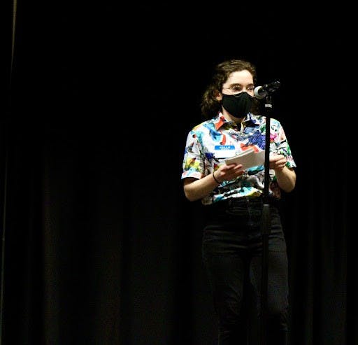 Department of Women’s and Gender Studies intern Lauren Szymczak opens the “Transgender Awareness Week Open Mic Night,” which was held in the L.A. Pittenger Student Center Nov. 17, 2021. Szymczak organized the event under the guidance of her supervisor, graduate assistant Betsy Kiel. Sarah Olsen, DN