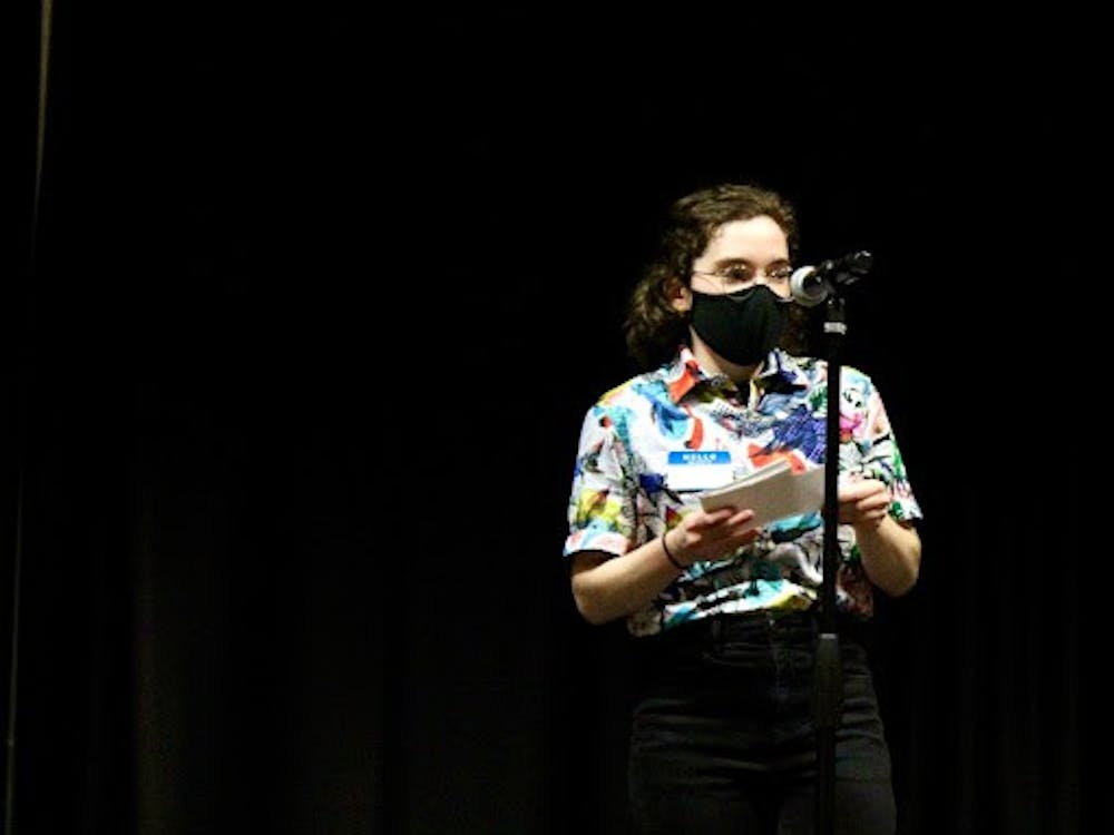 Department of Women’s and Gender Studies intern Lauren Szymczak opens the “Transgender Awareness Week Open Mic Night,” which was held in the L.A. Pittenger Student Center Nov. 17, 2021. Szymczak organized the event under the guidance of her supervisor, graduate assistant Betsy Kiel. Sarah Olsen, DN