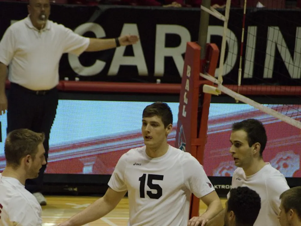 Sophomore outside attacker Marcin Niemczewski joins his celebrating teammates after getting a point against Loyola on Feb. 20 at Worthen Arena. Ball State lost 3-1. DN PHOTO. AUDREY ADDINGTON