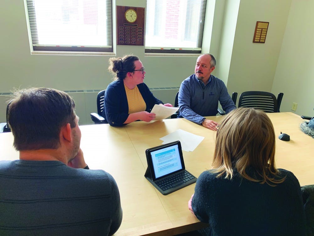 Michale DeLong relays the plans of her group to Adam Rude, an advisor for the one credit hour, independent study course dedicated to the ELECTRI International Green Energy Challenge. With her are group mates Cassie Deorony and Kevin Zielinski. Michale DeLong, photo provided