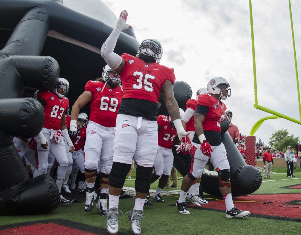 The Ball State football team runs out onto the field before the game against Western Michigan on Oct. 11 at Scheumann Stadium. DN PHOTO BREANNA DAUGHERTY