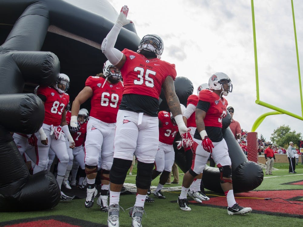 The Ball State football team runs out onto the field before the game against Western Michigan on Oct. 11 at Scheumann Stadium. DN PHOTO BREANNA DAUGHERTY