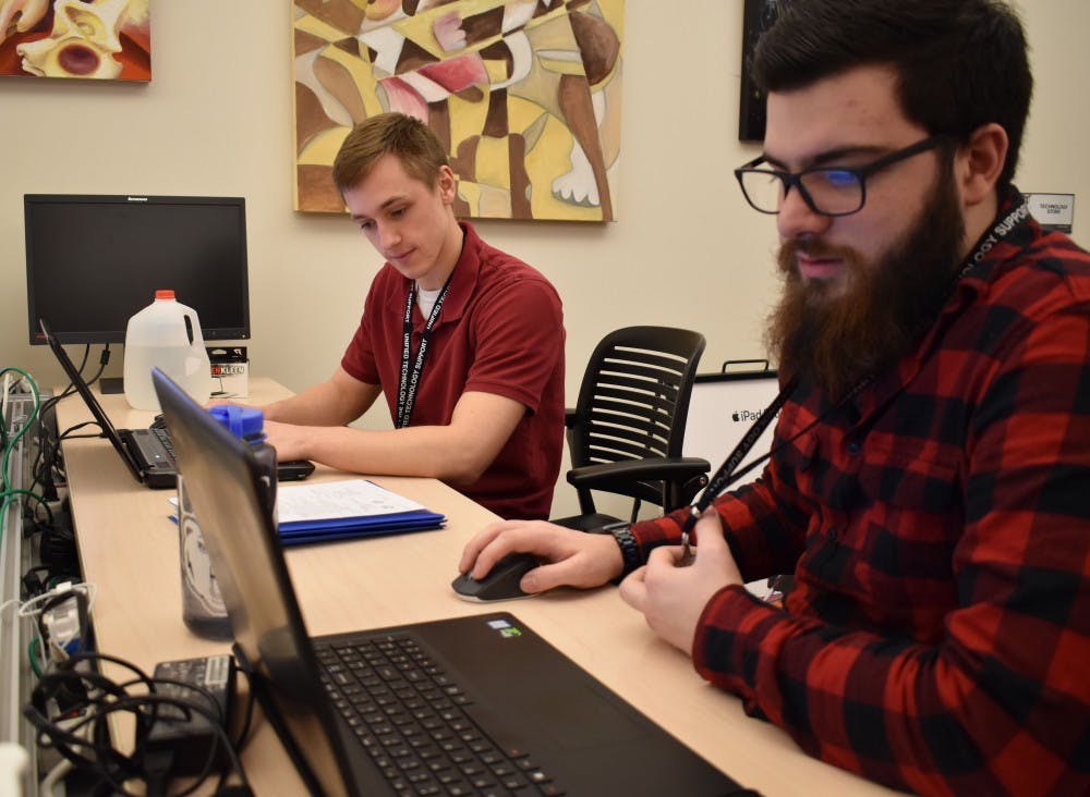 <p>Tech Center employees fix and clean students' laptops during the Love Your Computer Event on Wednesday, Feb. 14, 2018. This was the third year the Tech Center hosted the event in Bracken Library. <strong>Elena Stidham, DN</strong></p>