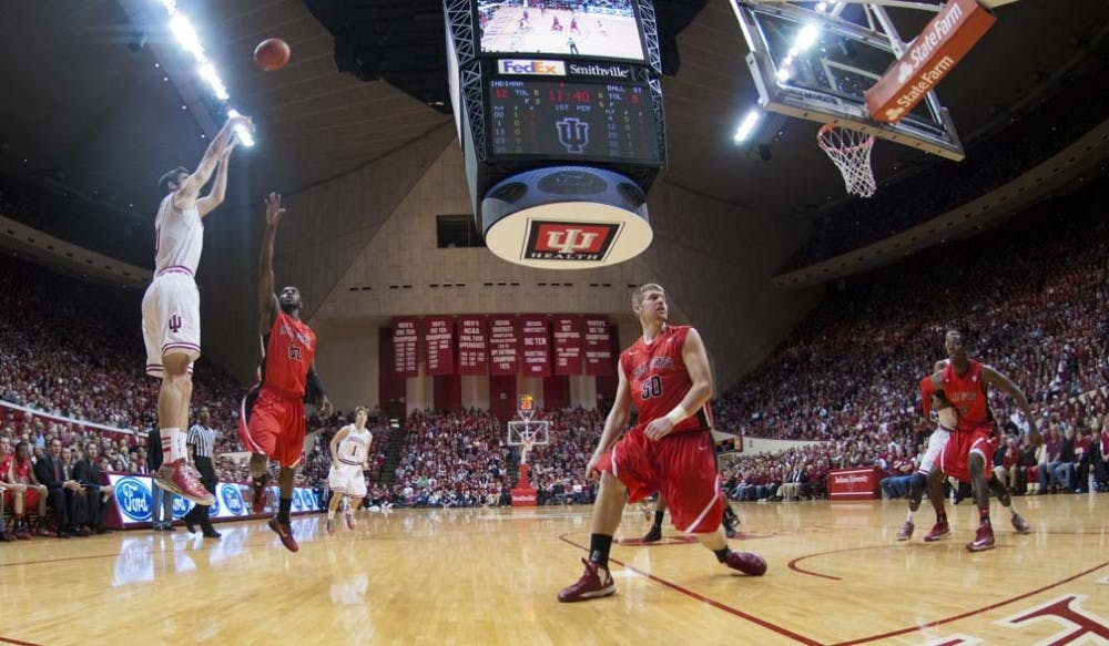 Indiana University’s Will Sheehey shoots a three-point shot in the first half of the Ball State-IU game Sunday. Sheehey led the Hoosiers with 19 points during its defeat of Ball State 101-53. DN PHOTO BOBBY ELLIS