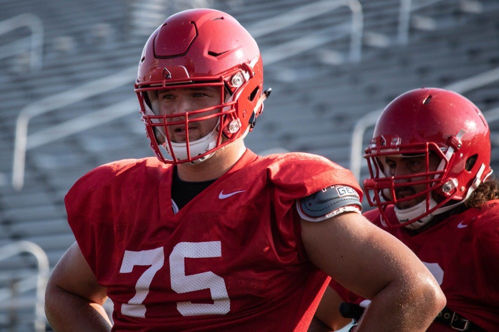 <p>Redshirt junior offensive lineman Danny Pinter stands in line to do a drill at practice Monday, Aug. 27, 2018 at Scheumann Stadium. In 2017 Pinter had a season-ending injury in the game against Central Michigan. Rebecca Slezak,DN</p>