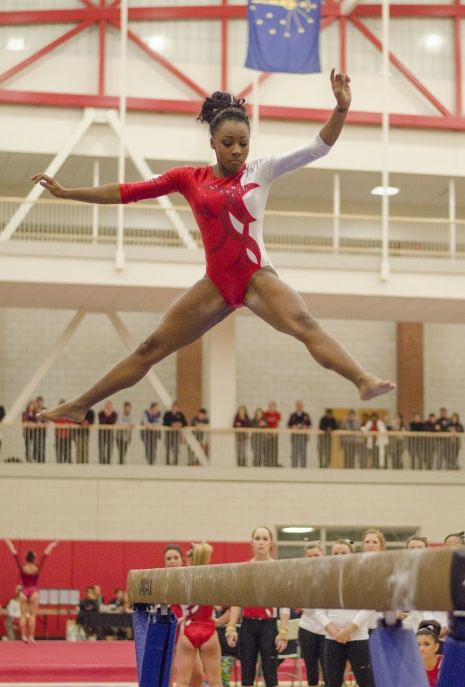 Junior Denasiha Christian performs her routine on the balance beam during the meet against Central Michigan on Jan. 23 at Irving Gymnasium. DN PHOTO BREANNA DAUGHERTY