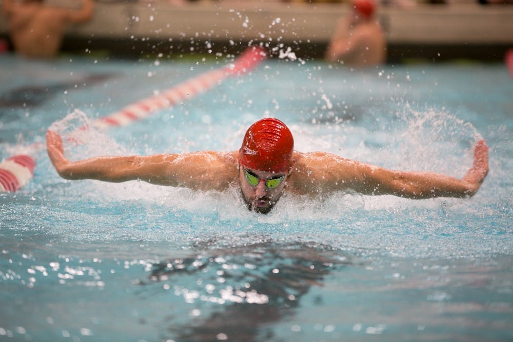 <p>Sophomore Ben Andrew swims butterfly in the 400-yard medley relay during the meet against Grand Valley State on Nov. 18 in Lewellen Pool. <strong>Kaiti Sullivan, DN</strong></p>