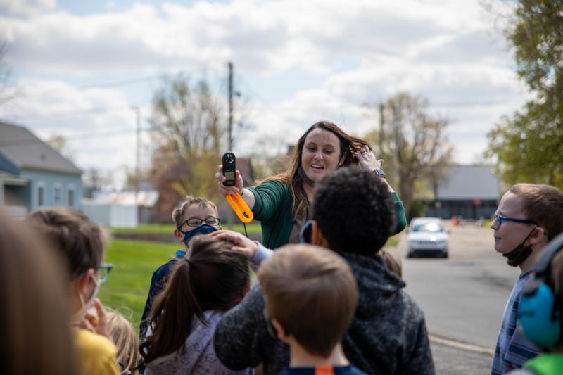 Courtney Williams, third-grade teacher at East Washington Academy, teaches her students how to use an anemometer April 19, 2021. As part of a third-grade project lead the way instruction, students in Muncie Community Schools learn weather patterns and animal life cycles. Jaden Whiteman, DN