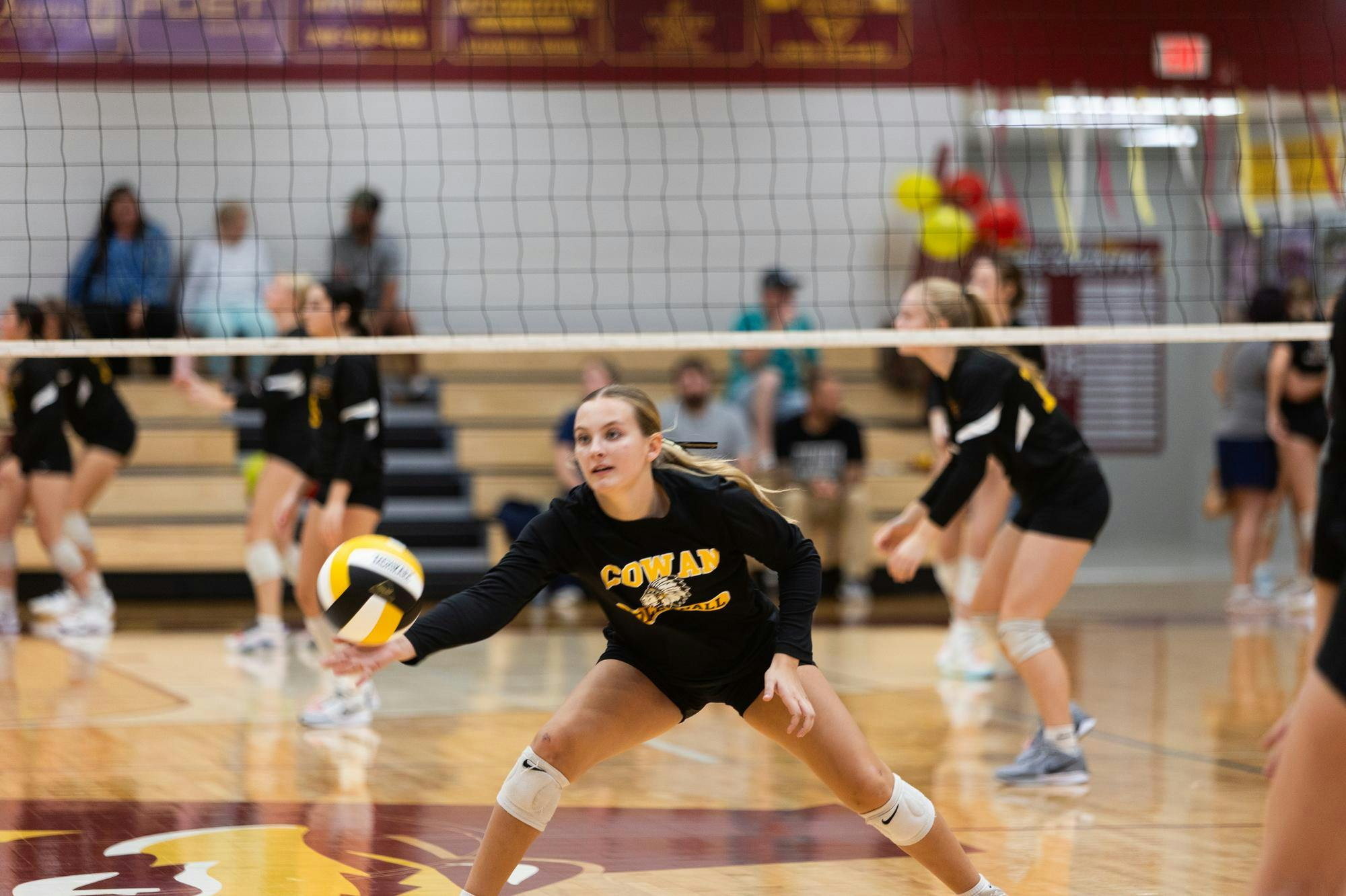 Senior, Taylor Young, warms up before the Blackhawks play. Young continued to be a key player this match against Alexandria - Monroe on Oct. 6th at Alexandria - Monroe High School. (Photo by Kaylee Kern) 