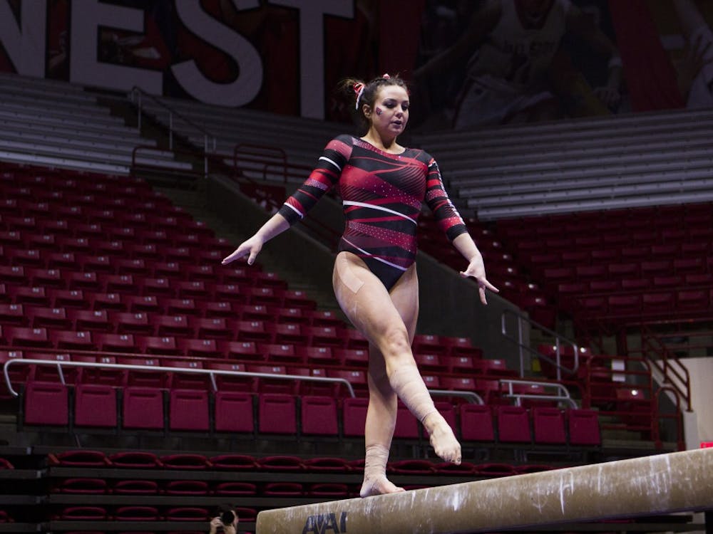 Senior Kayla Beckler performs her routine on the balance beam during the meet against Northern Illinois University on Jan. 15 in Worthen Arena. Emma Rogers // DN