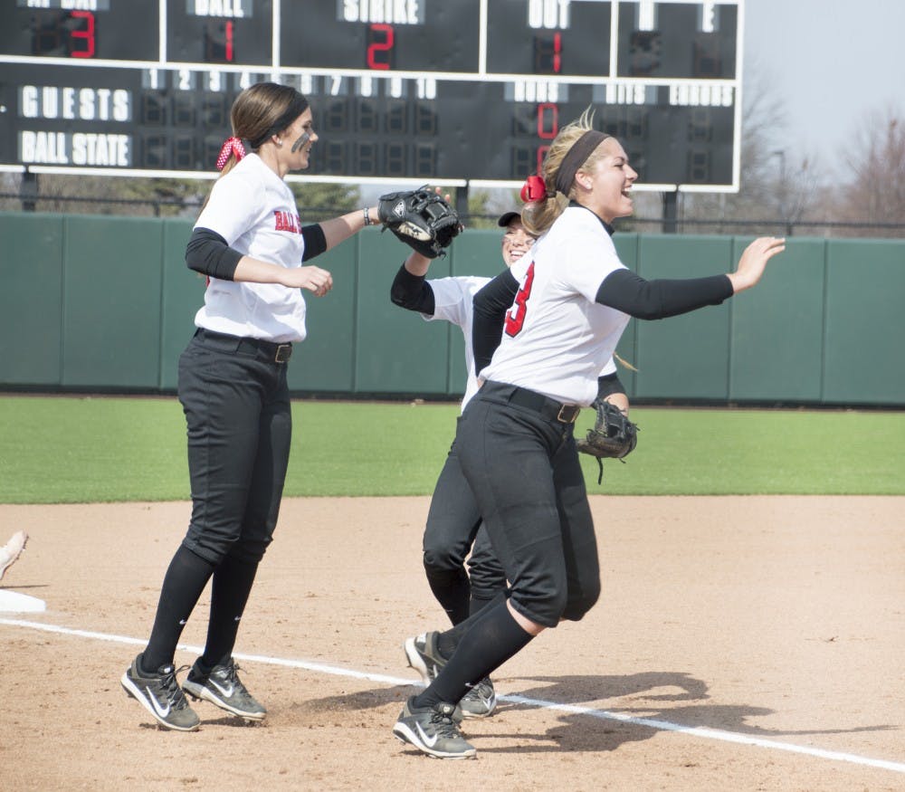 Members of the Ball State softball team cheer during the second game of the double header against Western Kentucky at First Merchants Ballpark Complex on March 21. DN PHOTO ALAINA JAYE HALSEY