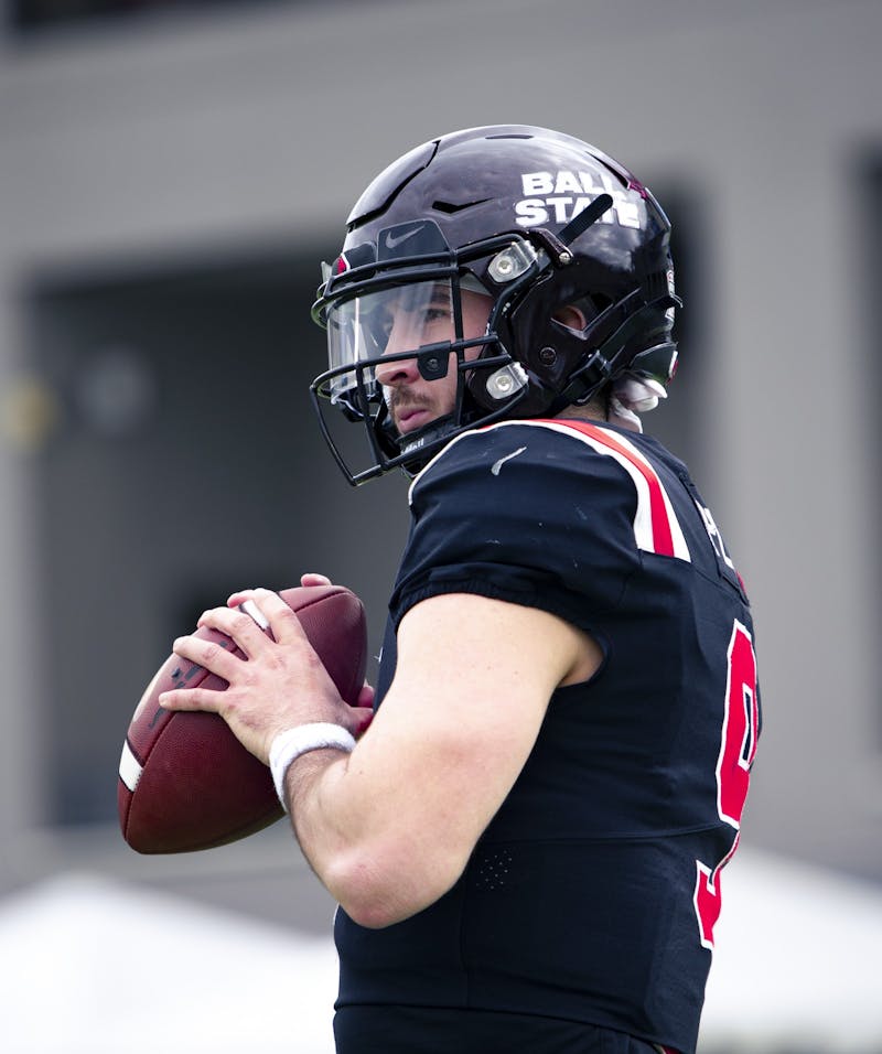 Redshirt senior quarterback Drew Plitt (9) warms up with teammate redshirt junior quarterback John Paddock at the 2021 TaxAct Camellia Bowl against Georgia State at the Cramton Bowl in Montgomery, Ala. Dec. 25. The Cardinals fell to the Panthers 51-20. Jacy Bradley, DN
