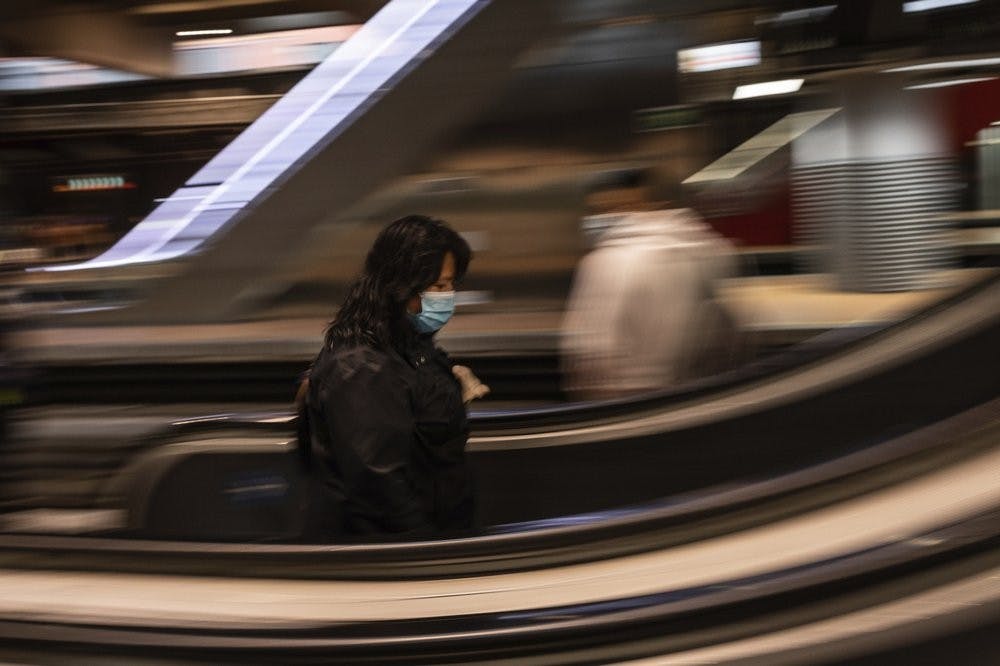 A commuter wears a face mask April 13, 2020, to protect against coronavirus at Atocha train station in Madrid, Spain. Spain is cautiously re-starting some business activity to emerge from the nationwide near-total freeze that helped slow the country's grim coronavirus outbreak. (AP Photo/Bernat Armangue)