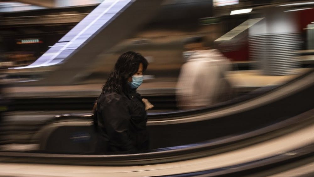 A commuter wears a face mask April 13, 2020, to protect against coronavirus at Atocha train station in Madrid, Spain. Spain is cautiously re-starting some business activity to emerge from the nationwide near-total freeze that helped slow the country's grim coronavirus outbreak. (AP Photo/Bernat Armangue)