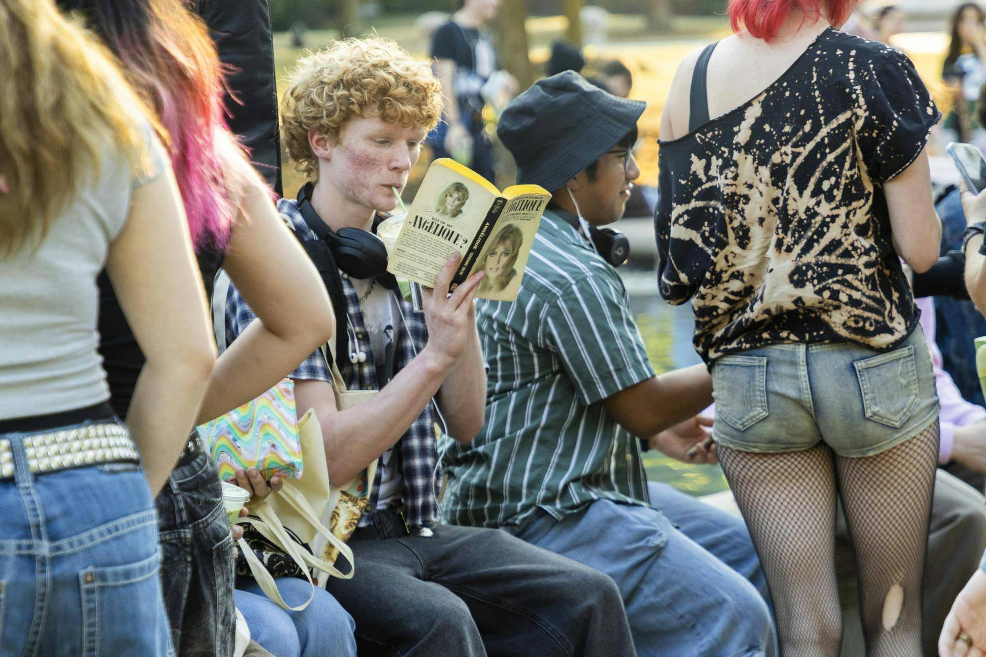 Ball State student sips on matcha and reads a book. Performative Male Contest was held at University Green on Sept. 17. Brenden Rowan, DN