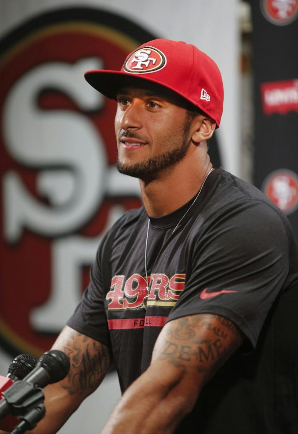 Quarterback Colin Kaepernick smiles as he talks about signing a six-year contract extension with the San Francisco 49ers in Santa Clara, Calif., on Wednesday, June 4, 2014. The contract is worth more than $110 million,  including a record $61 million guaranteed. (John Green/Bay Area News Group/MCT)