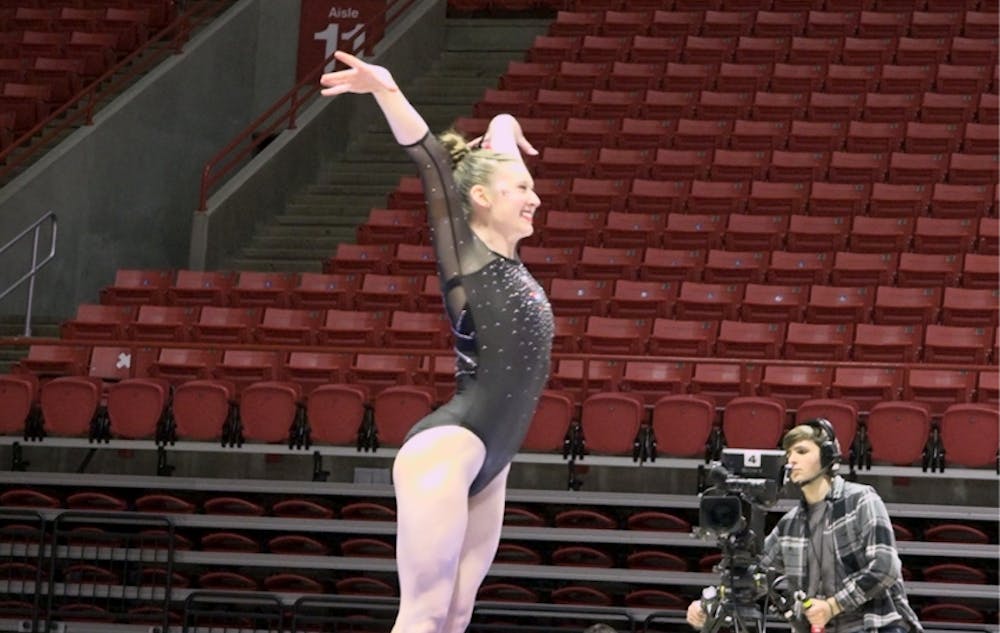 Ashley Szymanski strikes the landing on vault.