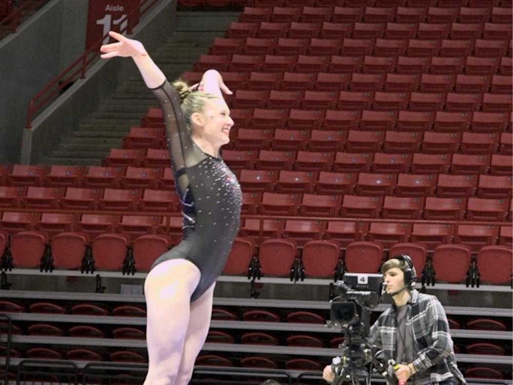 Ashley Szymanski strikes the landing on vault.