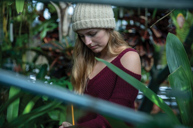 On the clock: Rinard Orchid Greenhouse student employees learn about plants, discipline