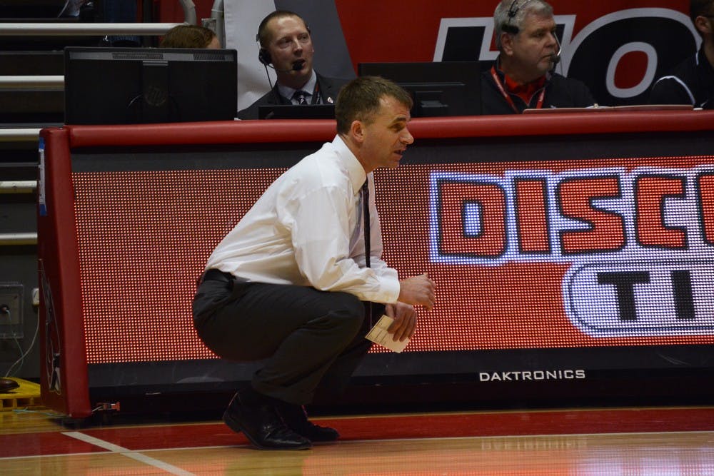 Head coach James Whitford attentively watching his team play during the game against Northern Illinois on Feb. 19 in Worthen Arena. DN PHOTO KORINA VALENZUELA