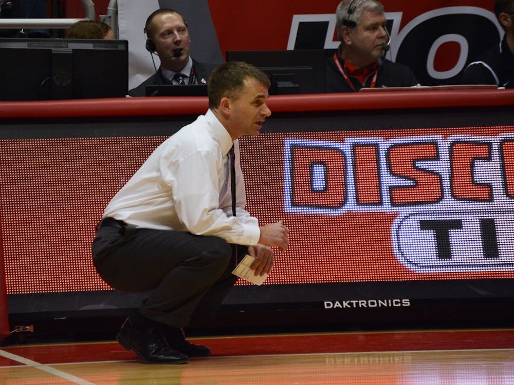 Head coach James Whitford attentively watching his team play during the game against Northern Illinois on Feb. 19 in Worthen Arena. DN PHOTO KORINA VALENZUELA