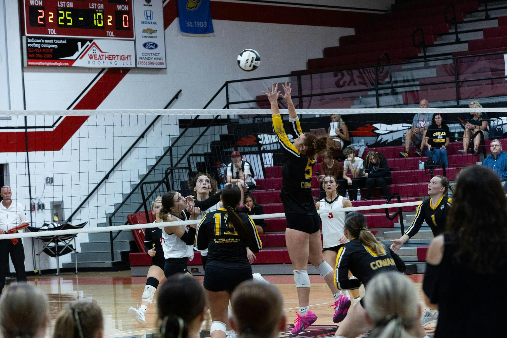 Junior Savannah Hall blocks the ball from coming over the net. Hall continued to play a key role in the front line against the Wapahani Raiders on Oct. 2 at Wapahani High School. (Photo by Kaylee Kern)
