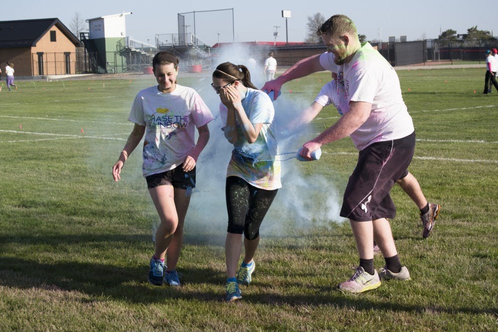 People participated in the 4th annual Chase the Rainbow 5K on April 16 at Bethel Field. Participants were colored with wet and dry paint throughout the course. DN PHOTO CURTIS SILVEY