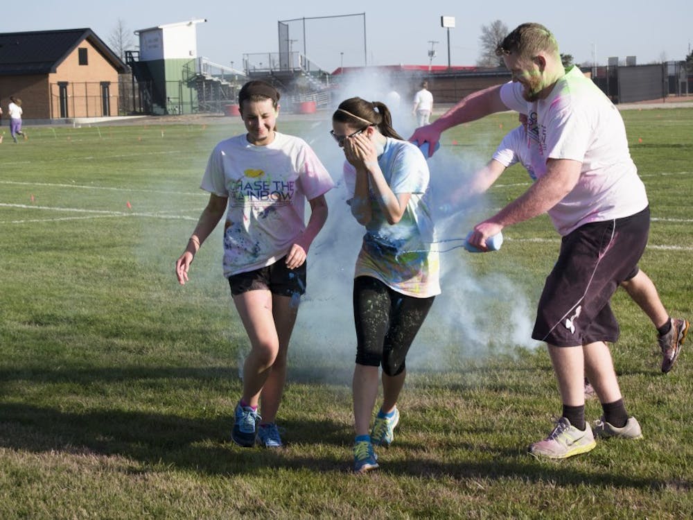 People participated in the 4th annual Chase the Rainbow 5K on April 16 at Bethel Field. Participants were colored with wet and dry paint throughout the course. DN PHOTO CURTIS SILVEY