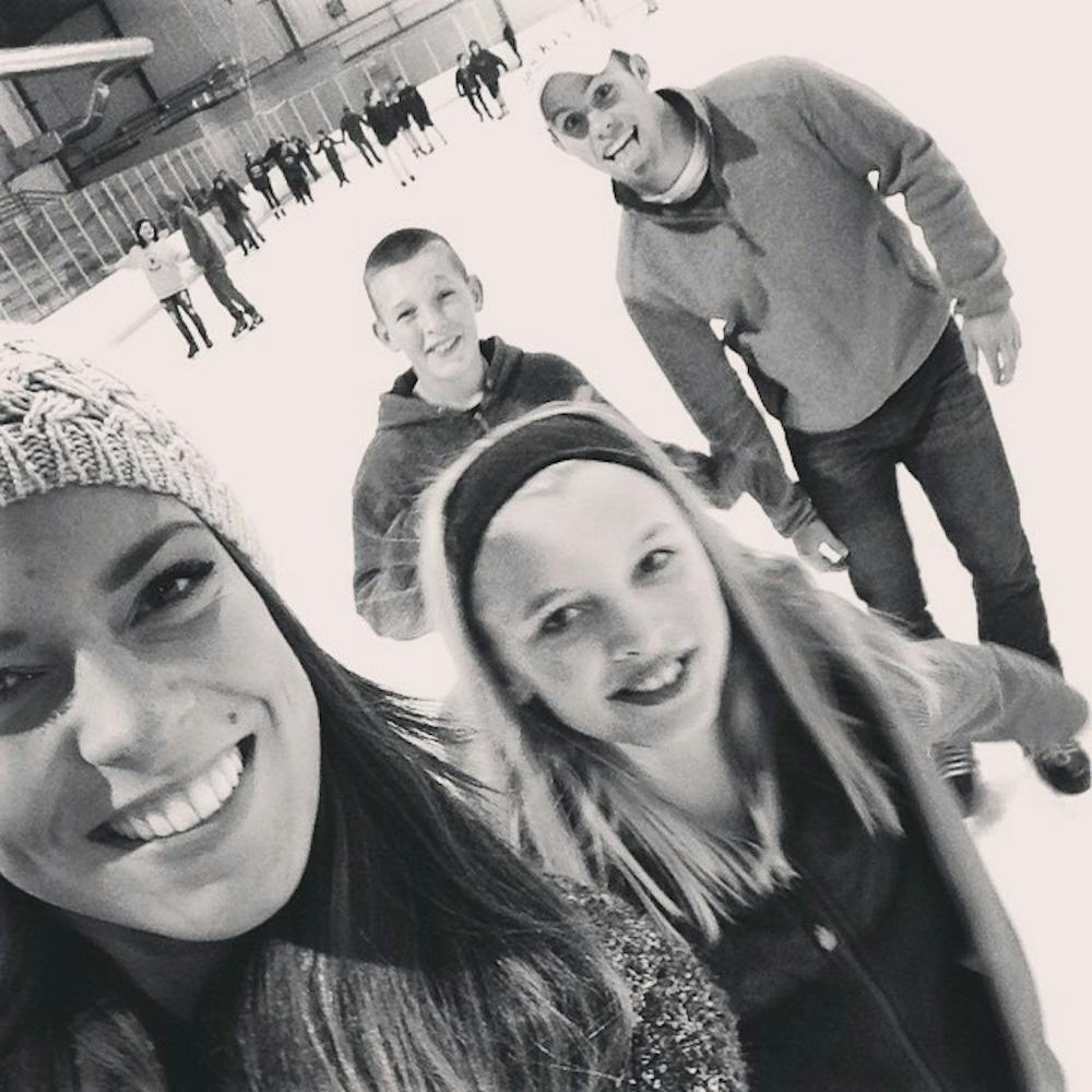 <p>Haley Snyder, a junior chemistry major, and her "little sister" Kaylee from Muncie's Big Brothers Big Sisters program, go on an ice skating "date" with her now ex-boyfriend Brock Frazer, a senior professional selling major and his "little brother" Kyler. Kaylee and Kyler are actual siblings.  <em>PHOTO PROVIDED BY HALEY SNYDER</em></p>