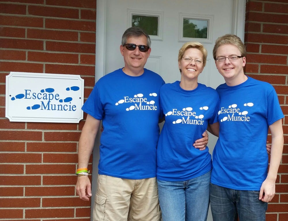 <p>(From left)&nbsp;Bruce Everetts, Jennifer Everetts and their son Andrew Walker opened Escape Muncie in July after the family visited an escape room in Cincinnati. The attraction locks visitors in rooms with&nbsp;clues to find, puzzles to solve and keys to use.&nbsp;<i style="font-size: 14px;">Escape Muncie // Photo Provided</i></p>