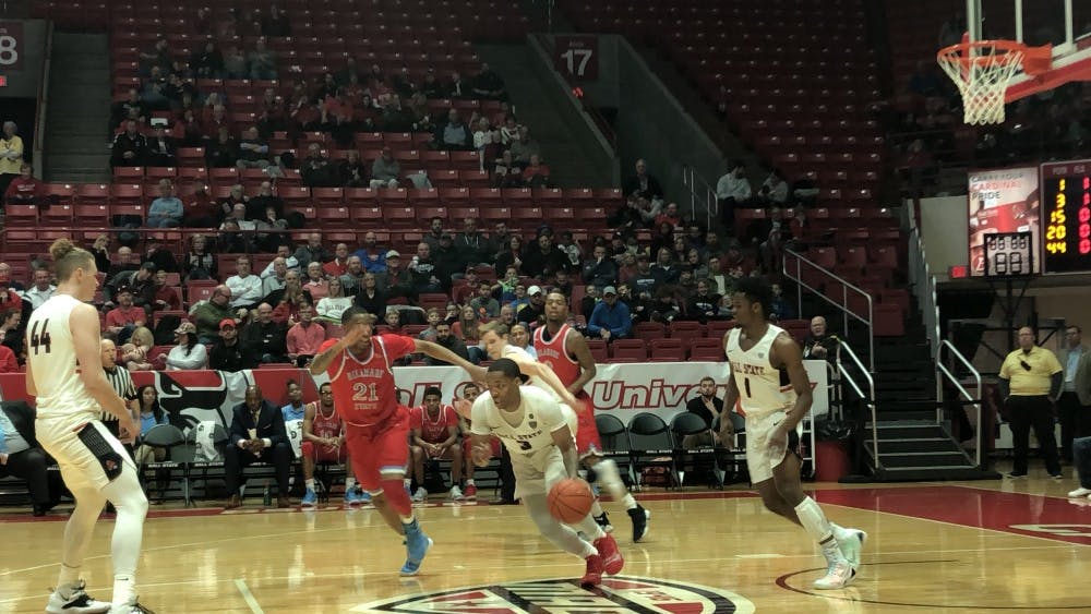 Redshirt junior guard Josh Thompson starts the offensive drive in a game against Delaware State on Dec. 29 at Worthen Arena. The Cardinals won 116-57. Jack Williams,DN