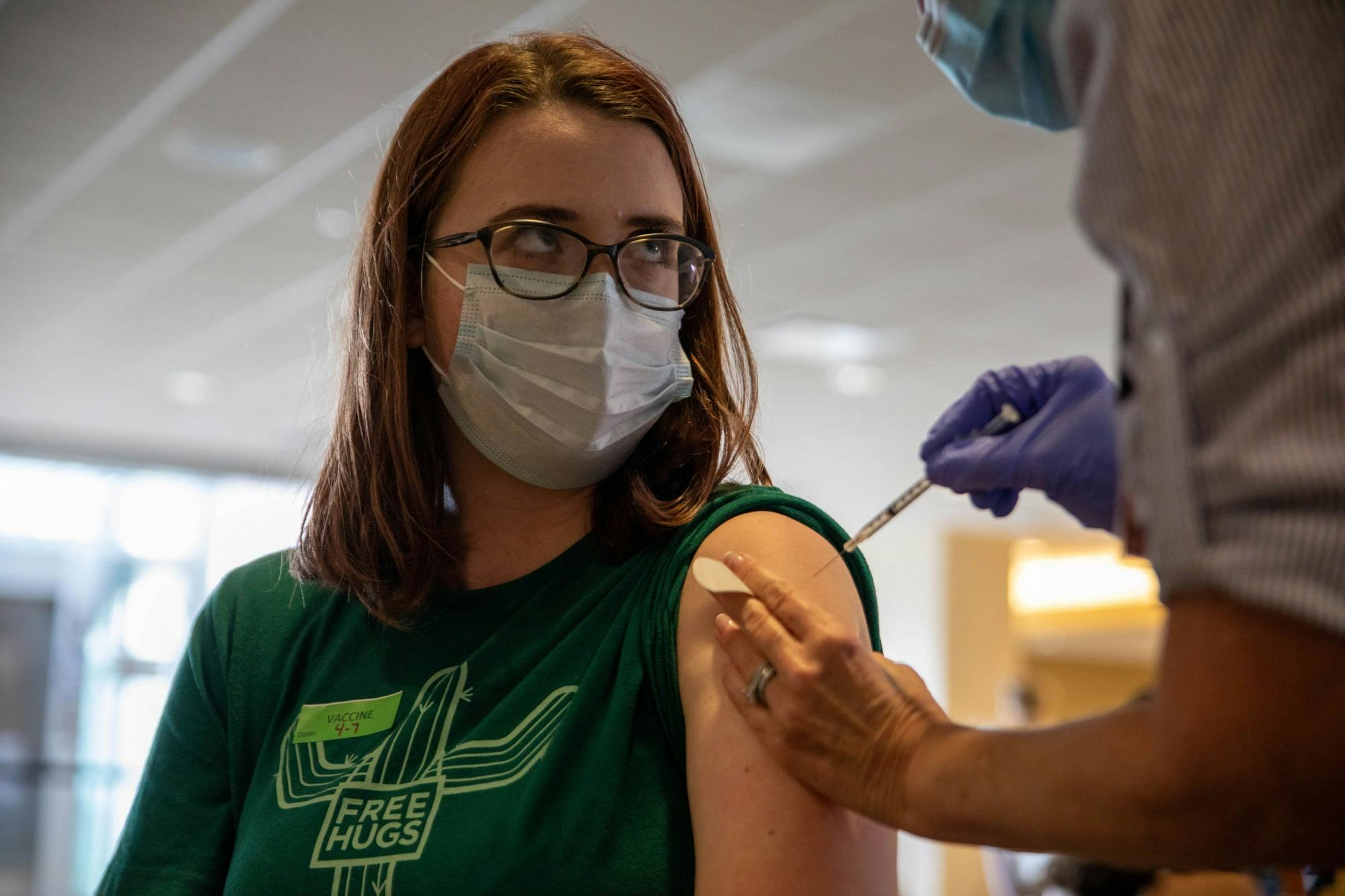 Sophomore journalism and telecommunications major Maya Wilkins gets the first dose of the COVID-19 vaccine April 7, 2021, at IU Health Ball Memorial Hospital. An Indiana state press release said more than 5.4 million Hoosiers are eligible to be vaccinated for COVID-19 after the state opened eligibility to people ages 16 and older. Jaden Whiteman, DN Illustration