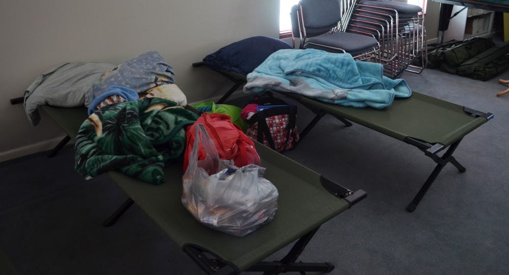 Joseph Fischer and his wife, Velva, slept in cots in the American Red Cross shelter on the night of Jan. 5 during the snowstorm. The couple and Velva's mother did not know the storm was coming until it was already here. DN PHOTO BREANNA DAUGHERTY 